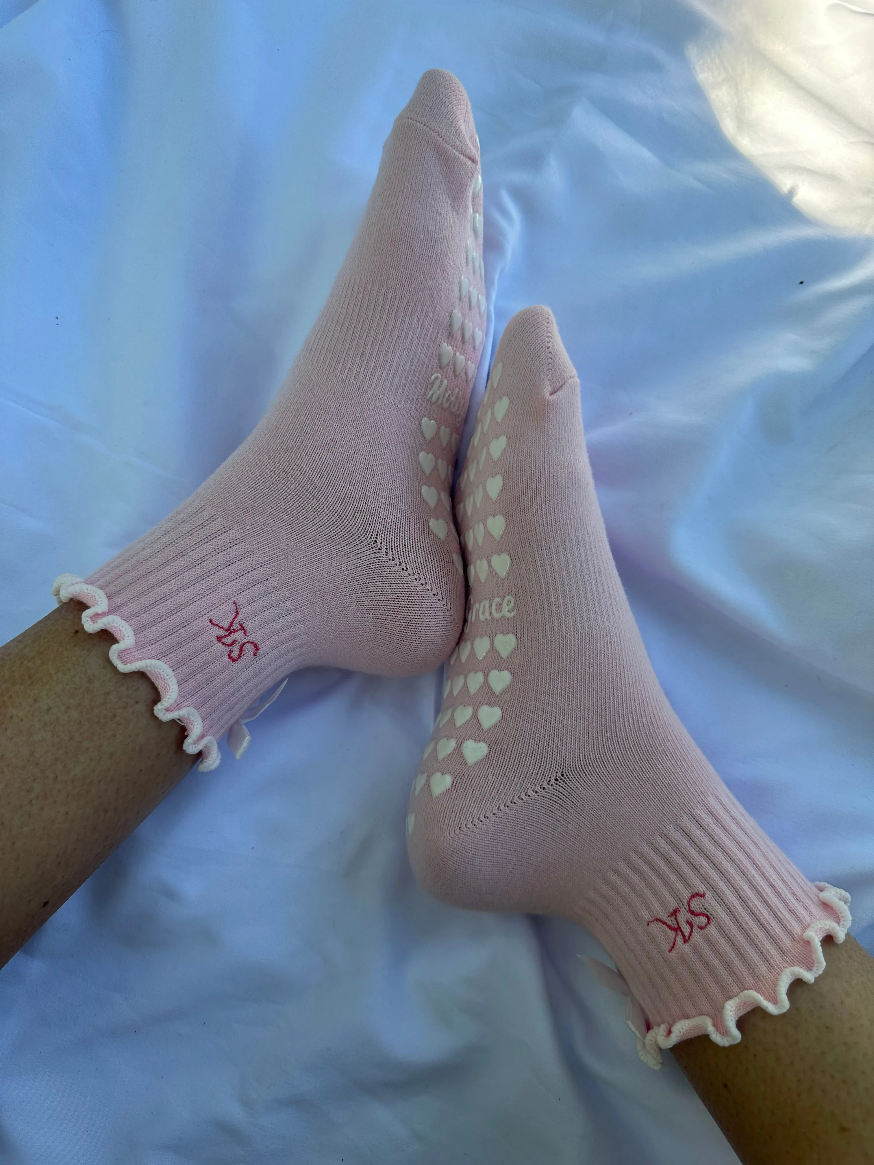 Pink & white custom initial grip sock with white bow